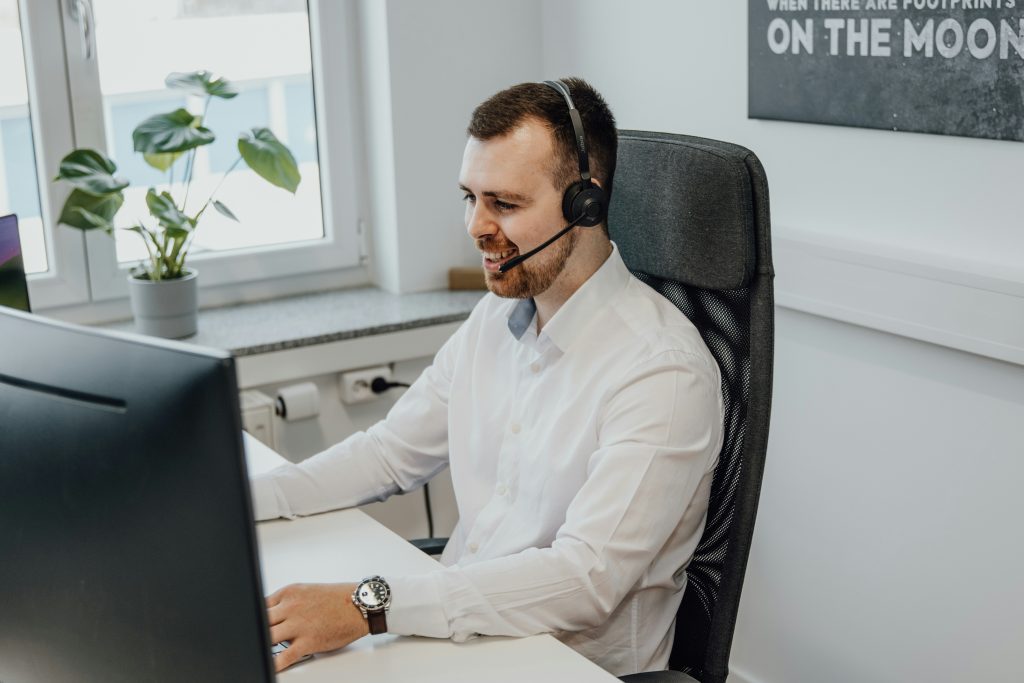 customer service representative at his desk