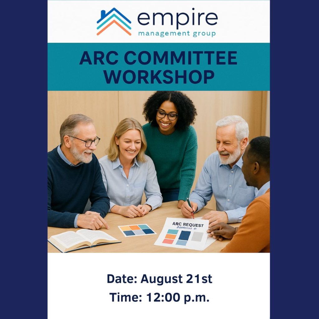 A diverse group of smiling adults sits around a table discussing color samples during an ARC Committee Workshop hosted by Empire Management Group.