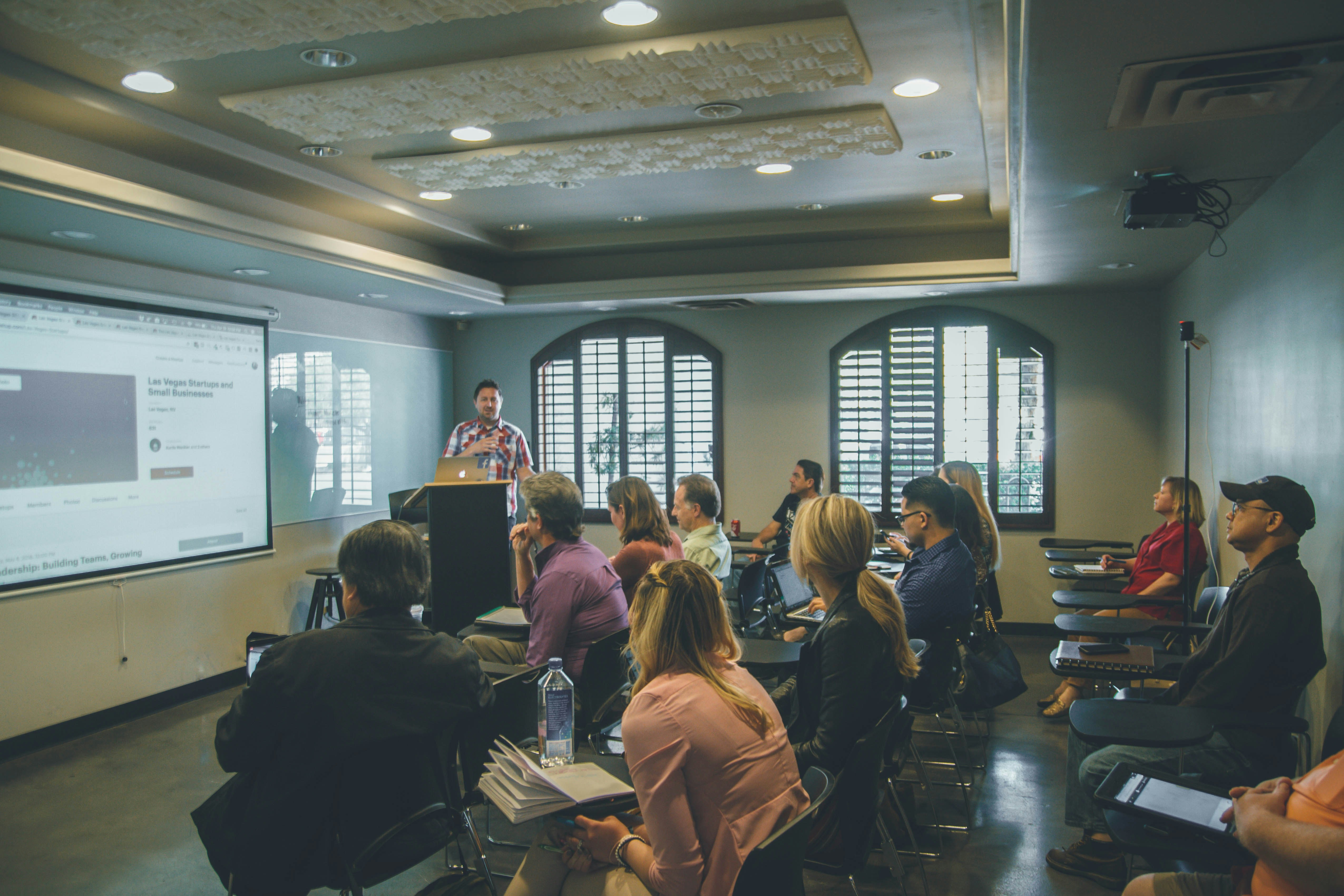 instructor with students in a classroom presenting