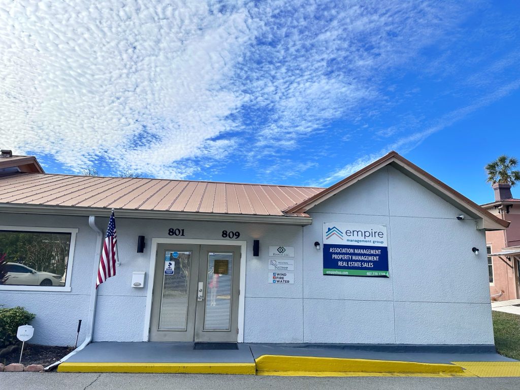 Empire Management Group’s Kissimmee, Florida office with signage for association and property management services.