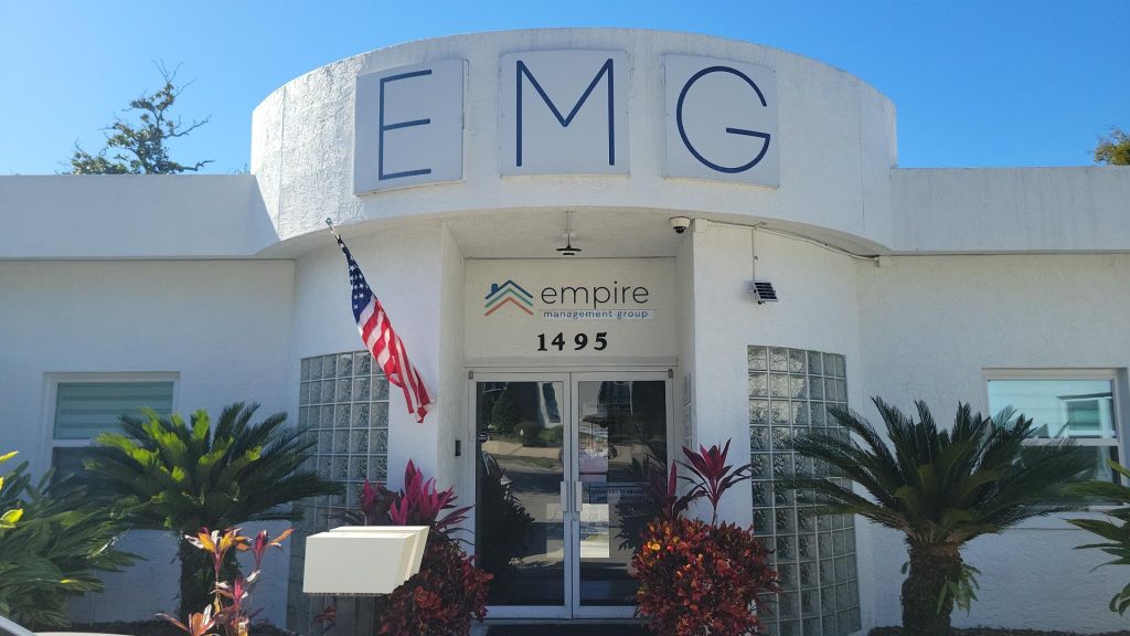Empire Management Group’s Maitland, Florida office with "EMG" signage above the entrance and a landscaped front entry.