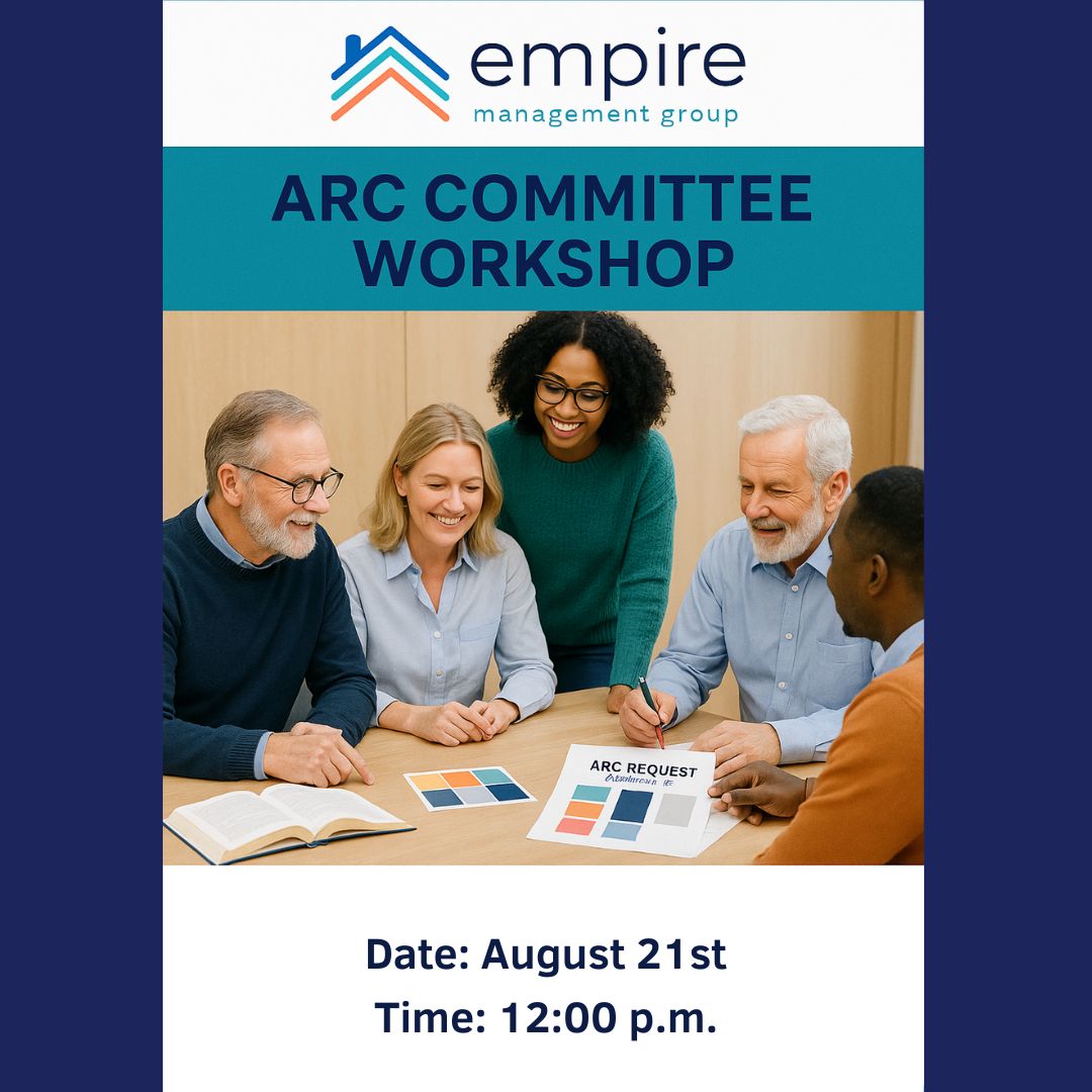 A diverse group of smiling adults sits around a table discussing color samples during an ARC Committee Workshop hosted by Empire Management Group.
