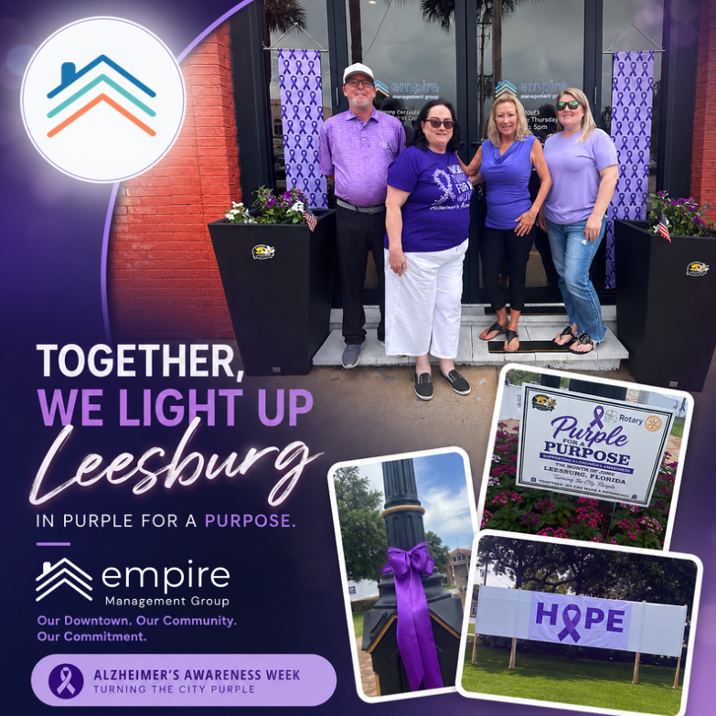 Empire Management Group team members standing in front of the Leesburg office during Alzheimer's Awareness Week as Downtown Leesburg turns purple for the Purple for a Purpose initiative. Purple ribbons, flowers, and community displays support Alzheimer's awareness while highlighting Empire Management Group's commitment to HOA and condominium association management services in Leesburg, Florida.